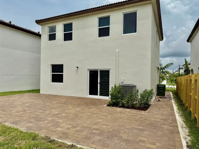 a kitchen with a refrigerator a stove a microwave and cabinets