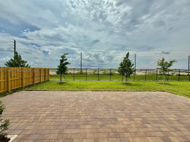 a bathroom with a sink toilet and a mirror