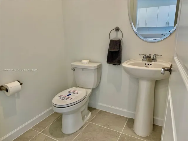 a bathroom with a sink and mirror