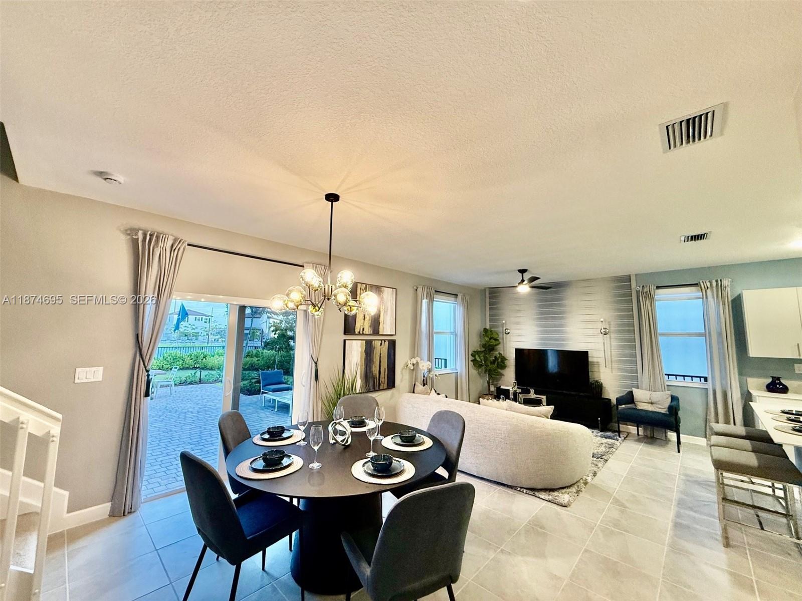 2600 Southeast 25th Street Homestead, FL 33035 - Photo 3 of 61 a large kitchen with a table and chairs