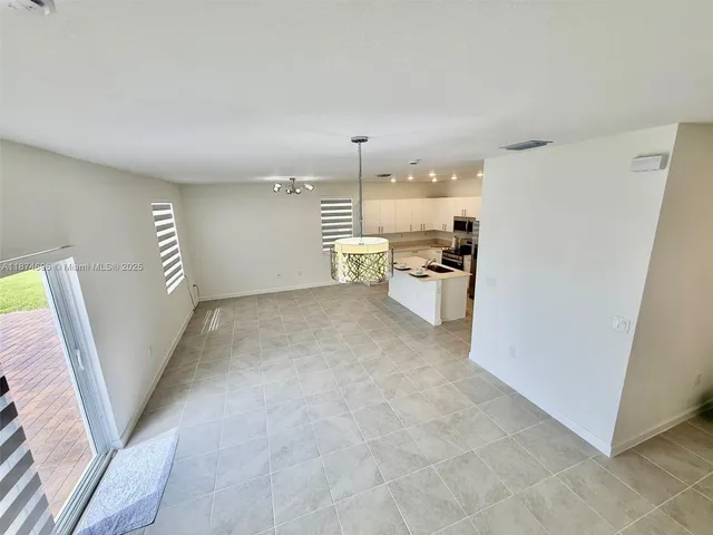 a bathroom with a double vanity sink and mirror