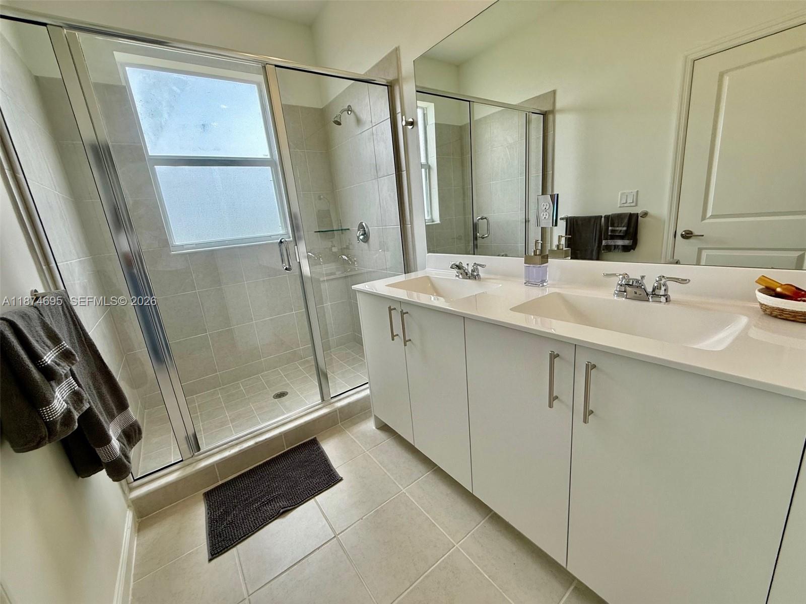2600 Southeast 25th Street Homestead, FL 33035 - Photo 34 of 61 a bathroom with a sink and mirror