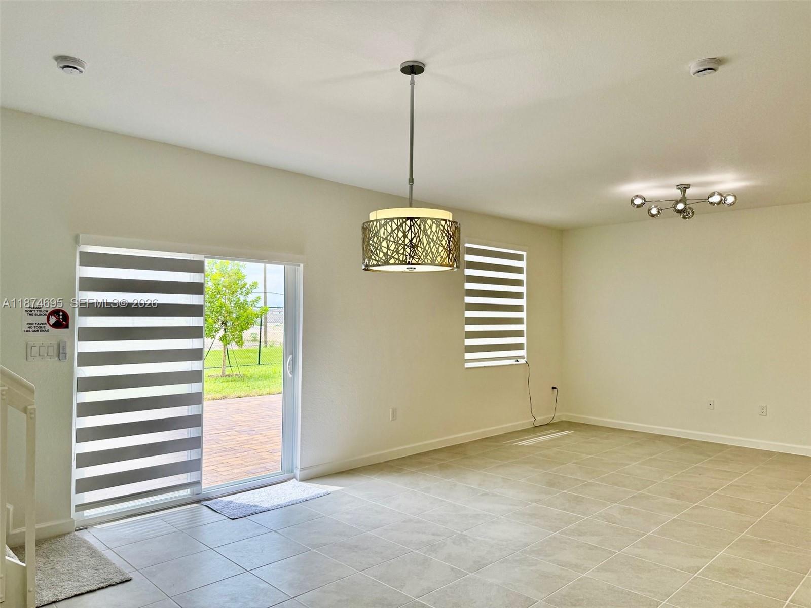 2600 Southeast 25th Street Homestead, FL 33035 - Photo 4 of 61 a view of a room with a window and furniture