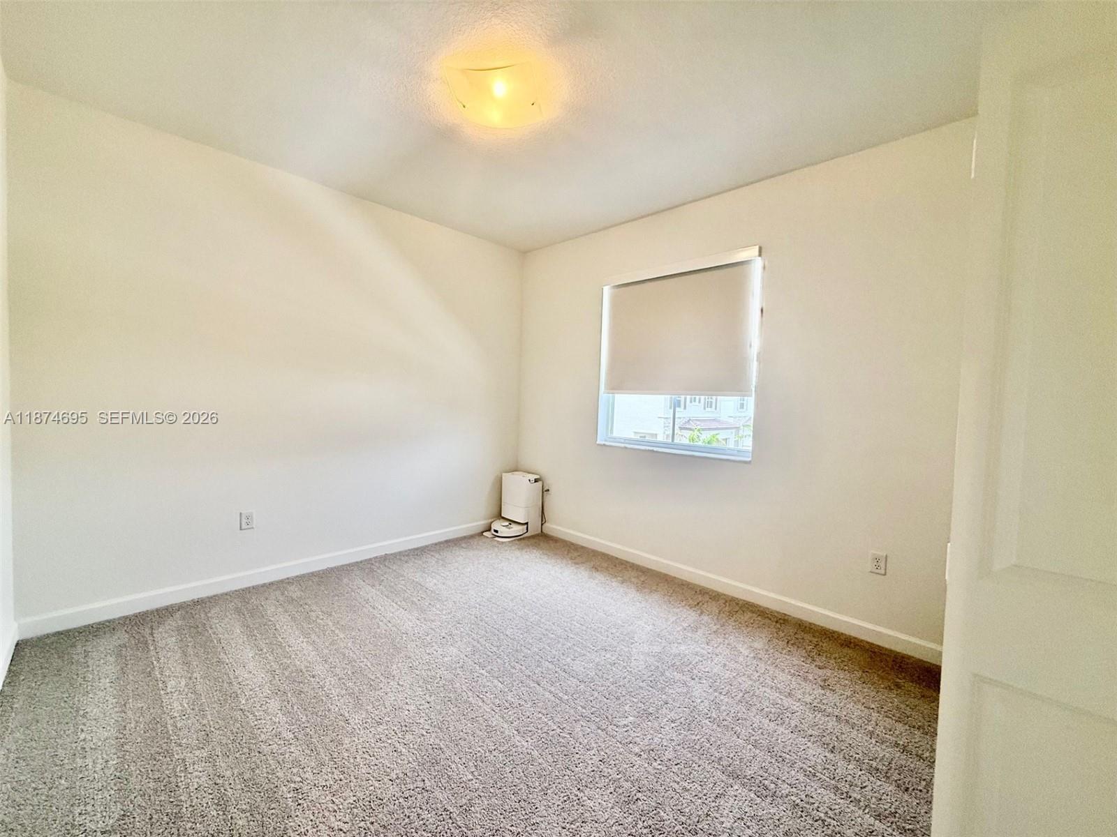 2600 Southeast 25th Street Homestead, FL 33035 - Photo 41 of 61 an empty room with a window