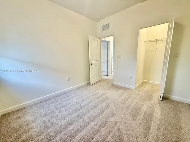 a view of a pathway gate with wooden walls