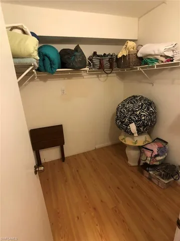 a blue bed sitting in a room next to a wall