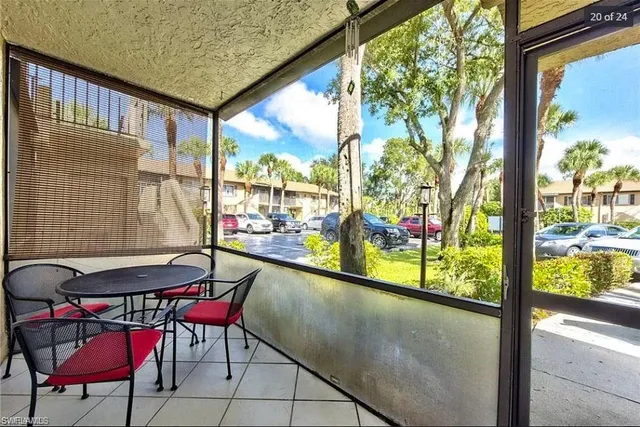 a view of a chairs and table in the balcony