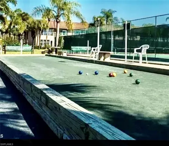 a view of swimming pool with chairs