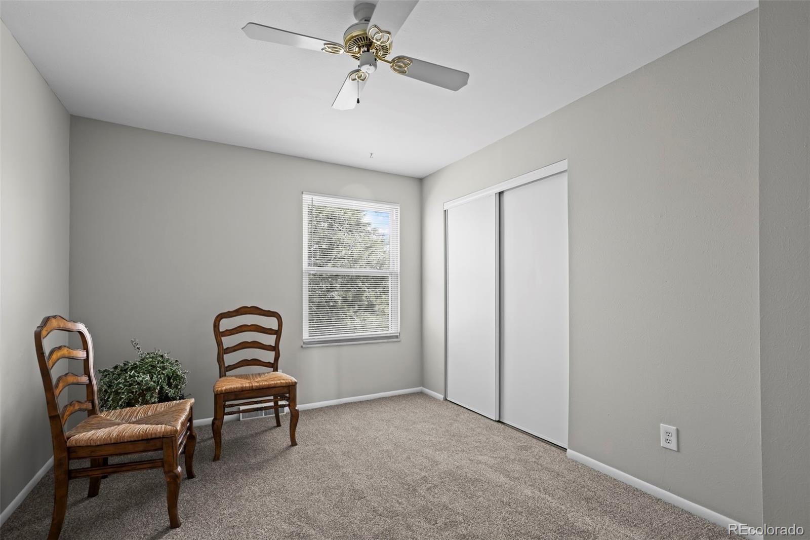 10721 Queen Street Broomfield, CO 80021 - Photo 13 of 25 a living room with furniture and a window