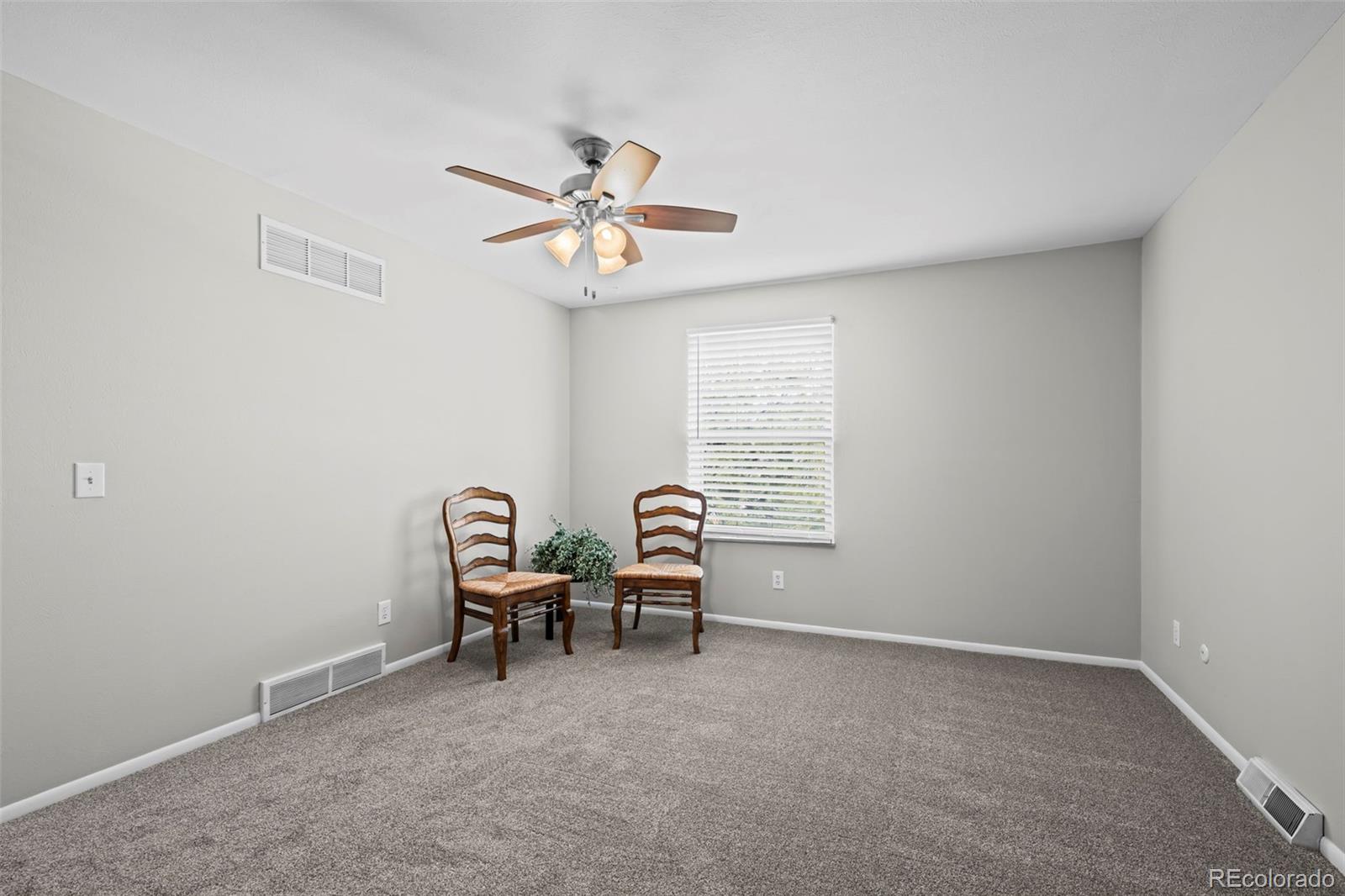 10721 Queen Street Broomfield, CO 80021 - Photo 17 of 25 a view of a room with windows and fan