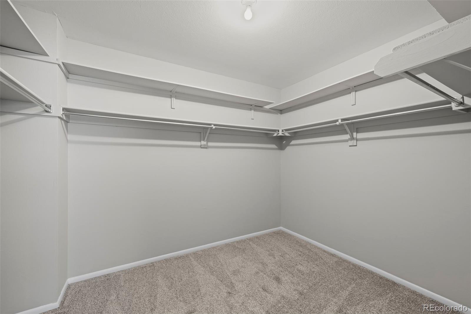 10721 Queen Street Broomfield, CO 80021 - Photo 19 of 25 a view of an empty walk in closet