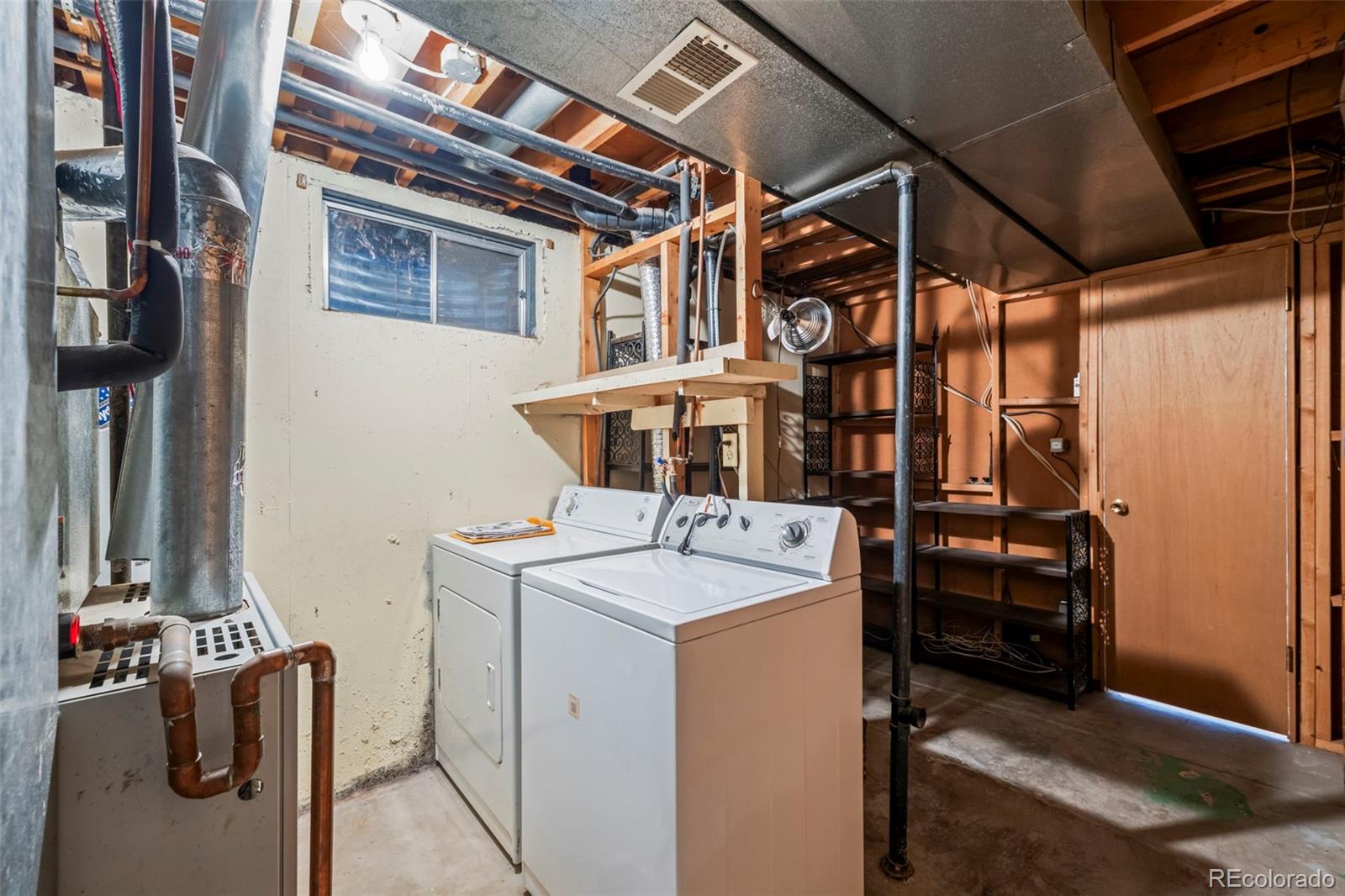 10721 Queen Street Broomfield, CO 80021 - Photo 22 of 25 a utility room with dryer and washer