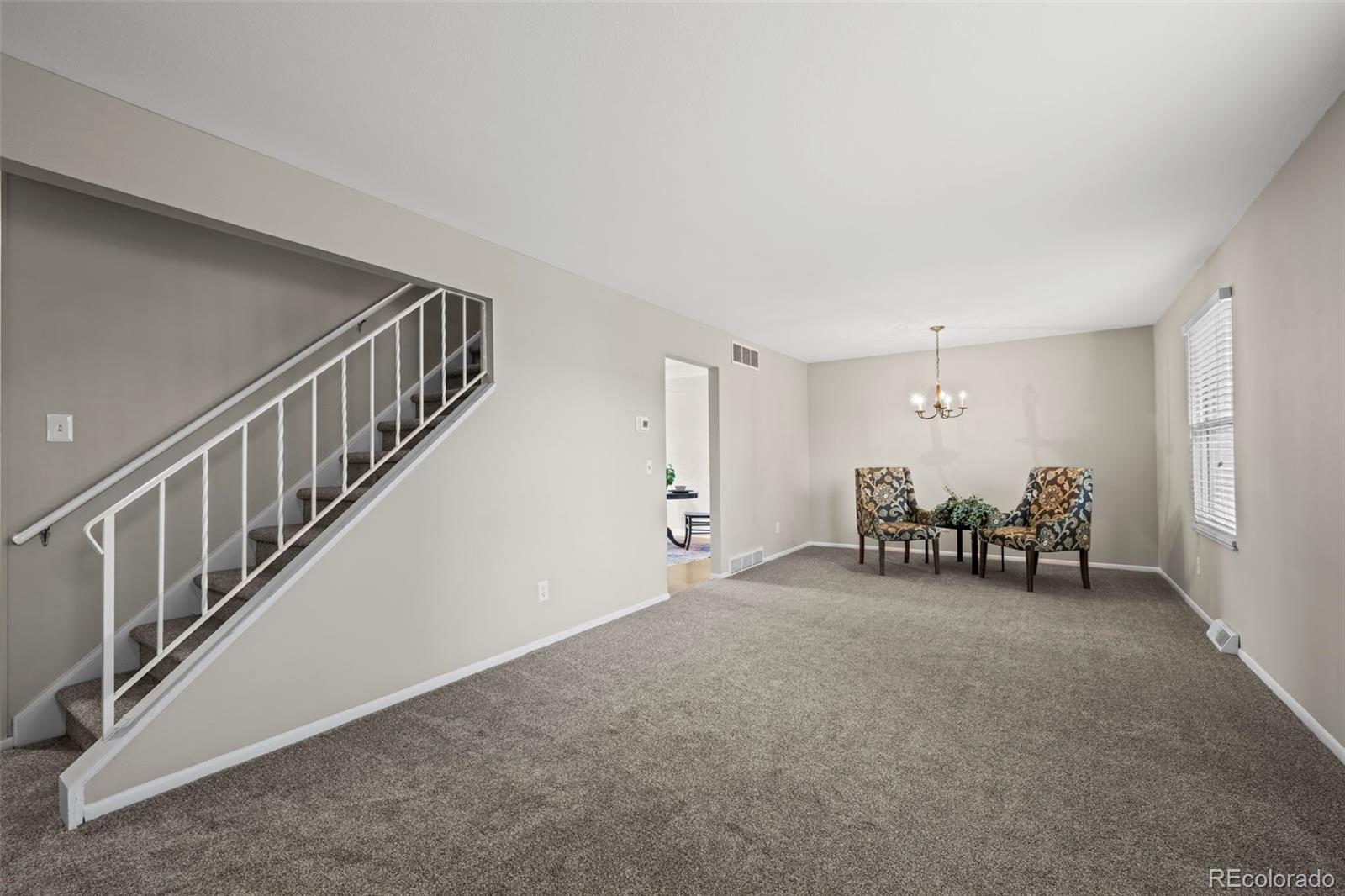 10721 Queen Street Broomfield, CO 80021 - Photo 6 of 25 a view of livingroom with furniture and white walls