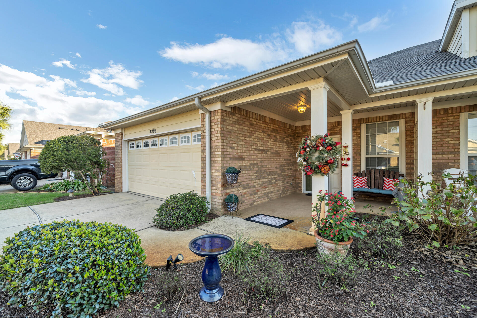 4206 Jade Loop Destin, FL 32541 - Photo 1 of 1 a front view of a house with garden