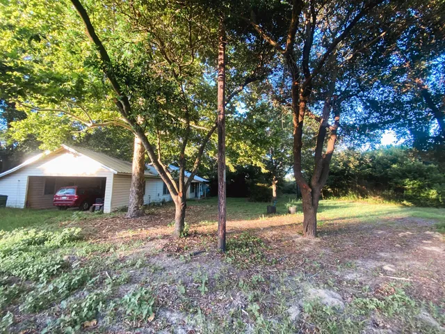 a view of a dining room with furniture and window