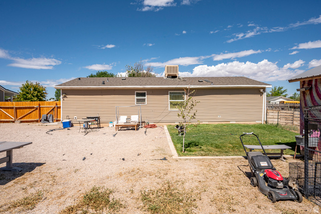 4296 Maple Lane Cedar City, UT 84721 - Photo 27 of 44 Fenced backyard featuring a gravel patio area and a separate grassy section