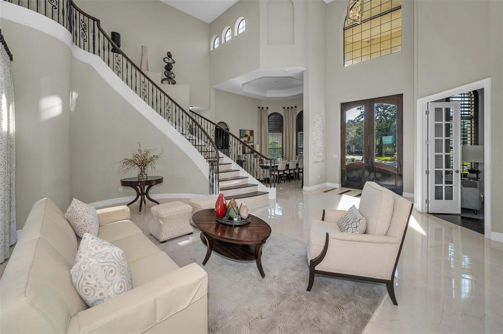 9829 Milano Drive Trinity, FL 34655 - Photo 15 of 100 a living room with furniture and a large window