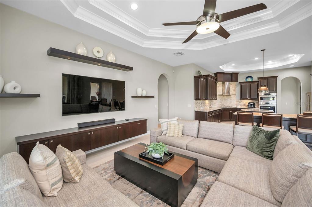 9829 Milano Drive Trinity, FL 34655 - Photo 37 of 100 a living room with furniture and a flat screen tv