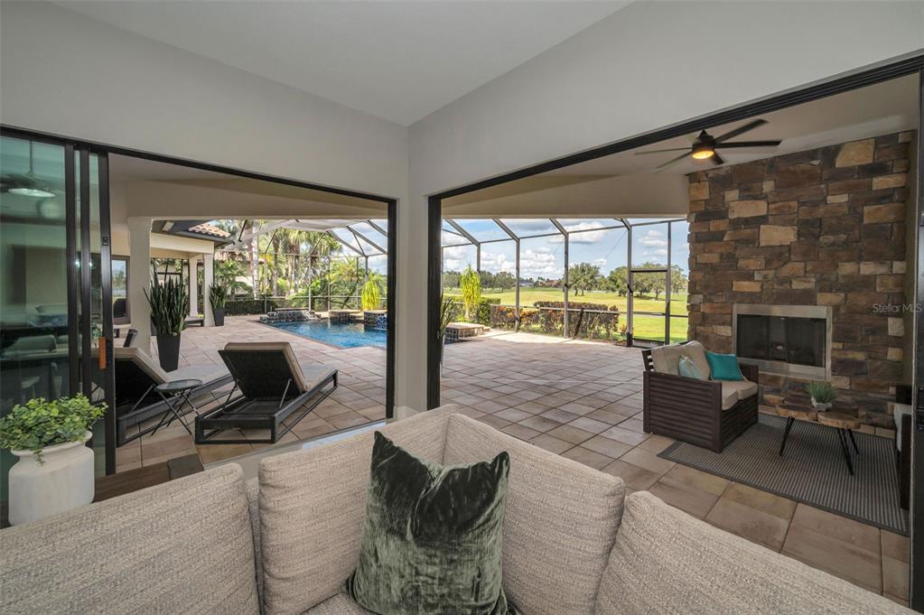 9829 Milano Drive Trinity, FL 34655 - Photo 39 of 100 a living room with furniture and a fireplace