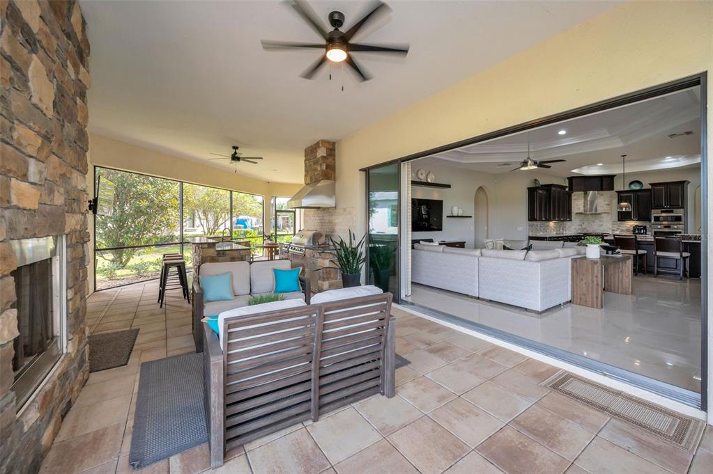 9829 Milano Drive Trinity, FL 34655 - Photo 78 of 100 a living room with furniture and a flat screen tv