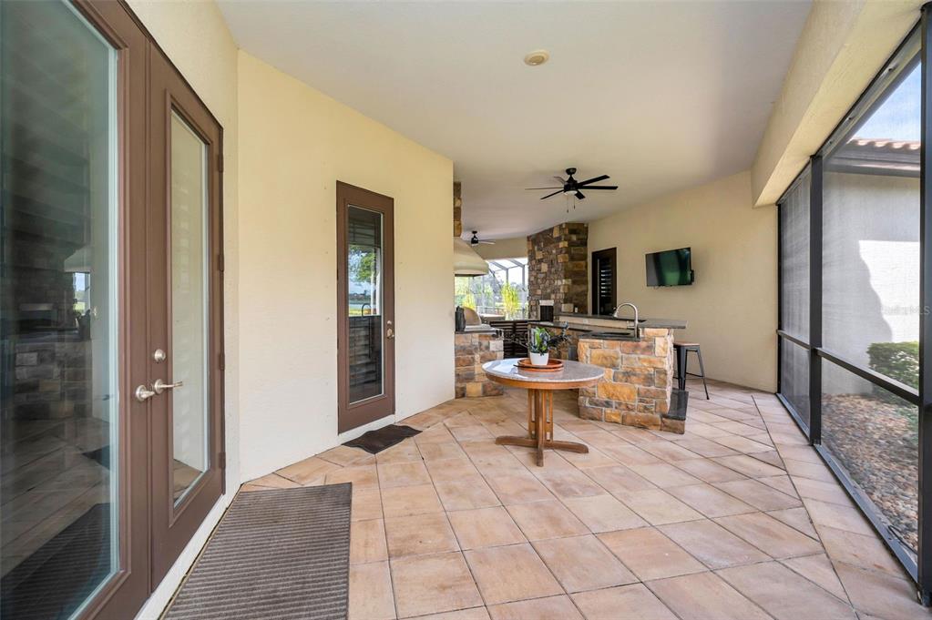 9829 Milano Drive Trinity, FL 34655 - Photo 81 of 100 a living room with furniture a rug and a table