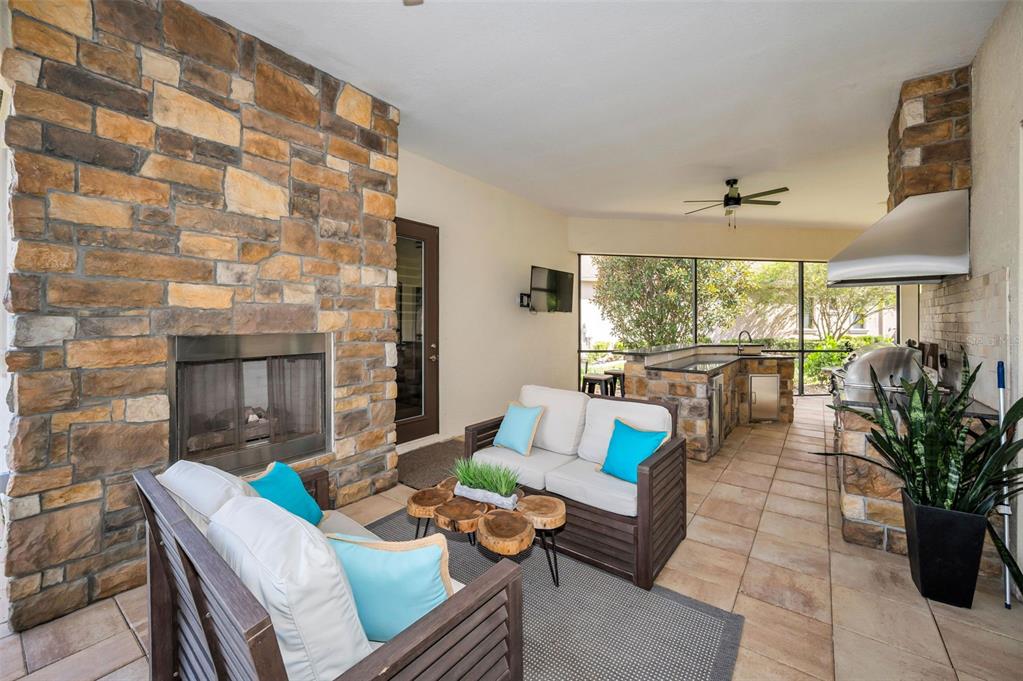 9829 Milano Drive Trinity, FL 34655 - Photo 83 of 100 a living room with furniture and a large window