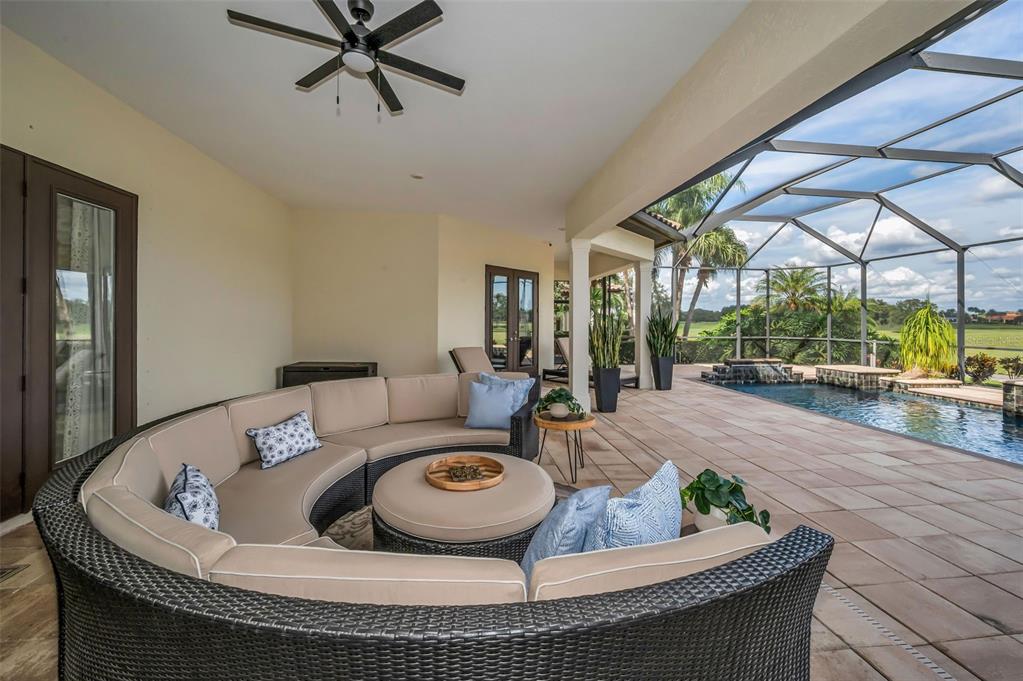 9829 Milano Drive Trinity, FL 34655 - Photo 85 of 100 a living room with furniture and a large window