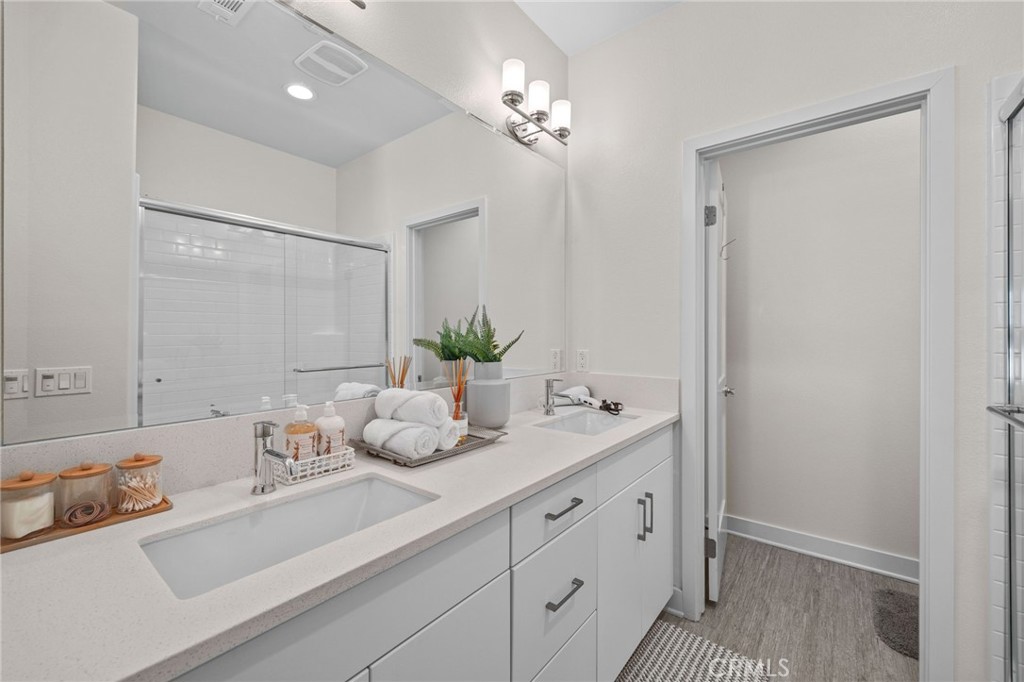 9040 Garvey Avenue, Unit 5 Rosemead, CA 91770 - Photo 13 of 33 a bathroom with a sink vanity granite and a mirror