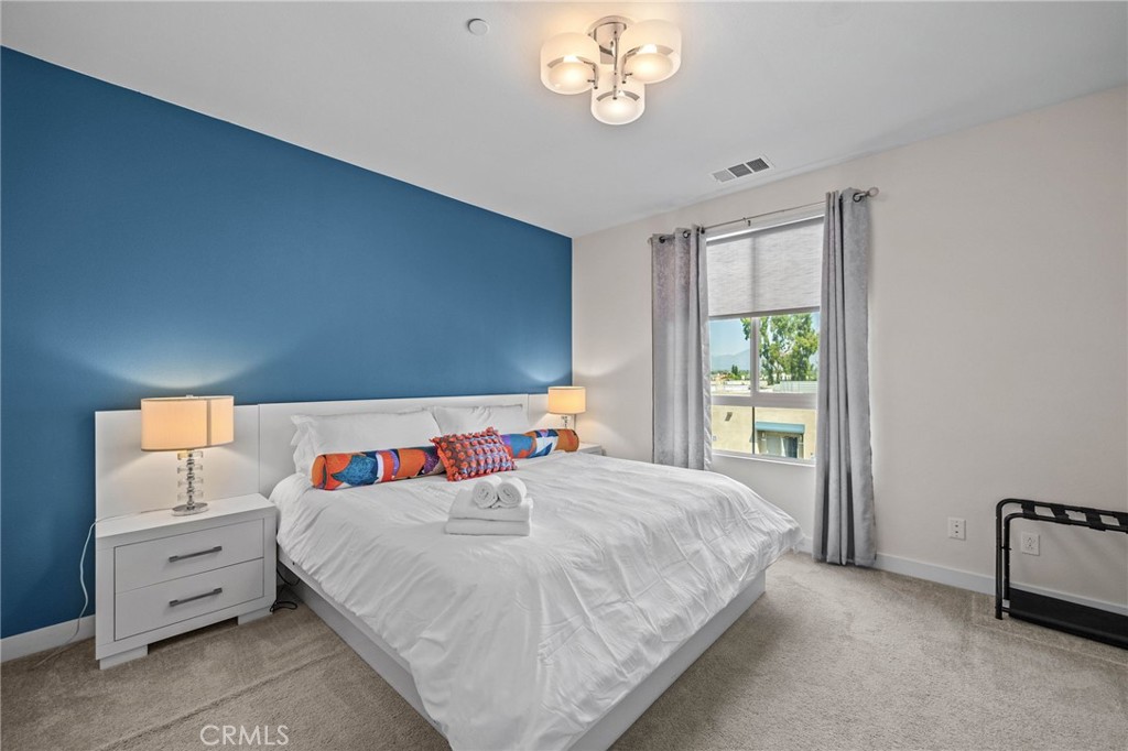 9040 Garvey Avenue, Unit 5 Rosemead, CA 91770 - Photo 14 of 33 a bedroom with a bed and a window