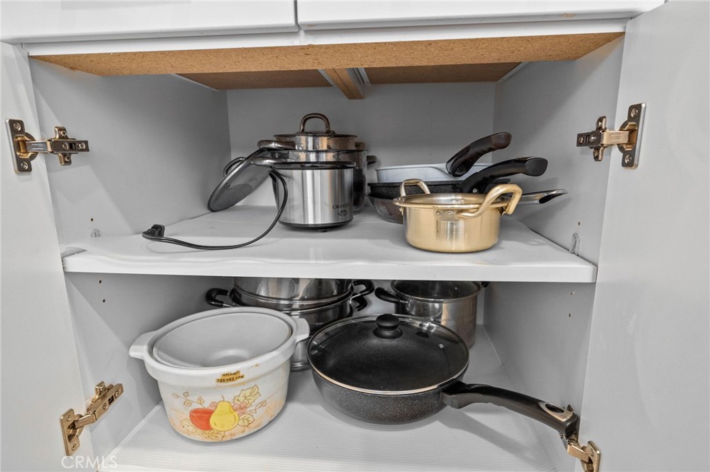 9040 Garvey Avenue, Unit 5 Rosemead, CA 91770 - Photo 22 of 33 a kitchen with a stove and a wooden floor