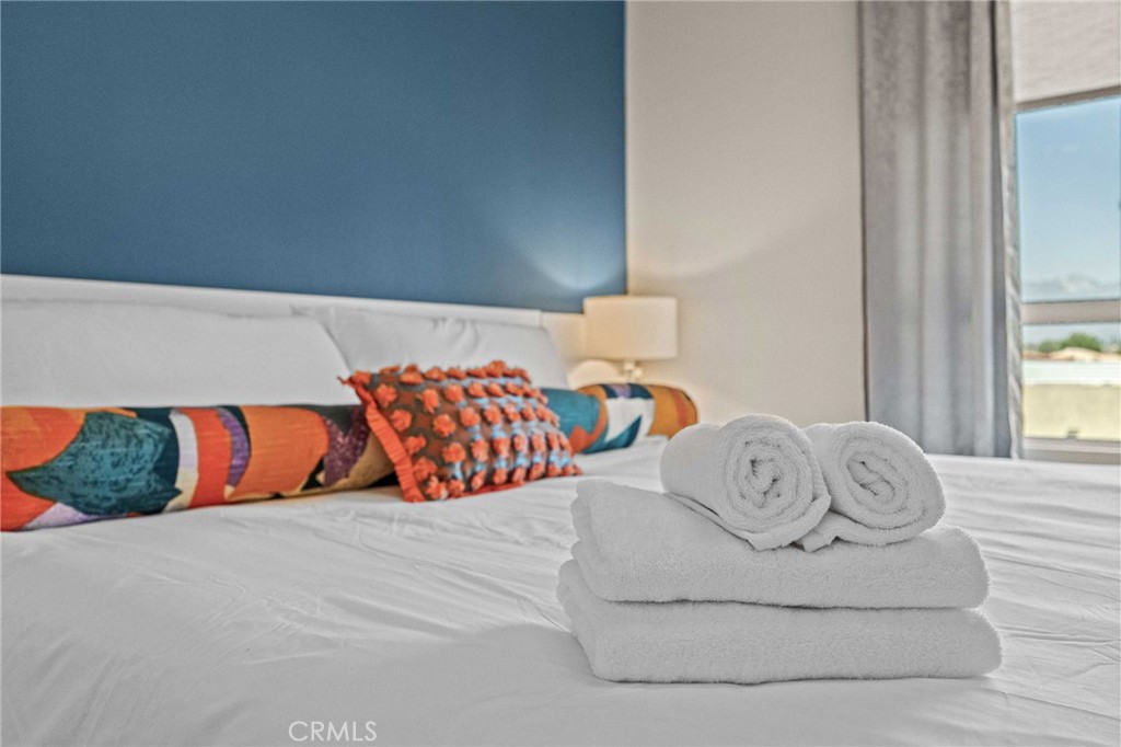 9040 Garvey Avenue, Unit 5 Rosemead, CA 91770 - Photo 24 of 33 a bedroom with a bed and a couch