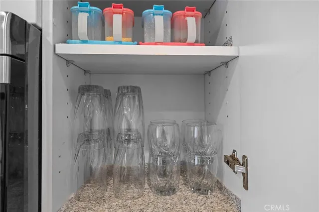 a bedroom with a bed and a mirror