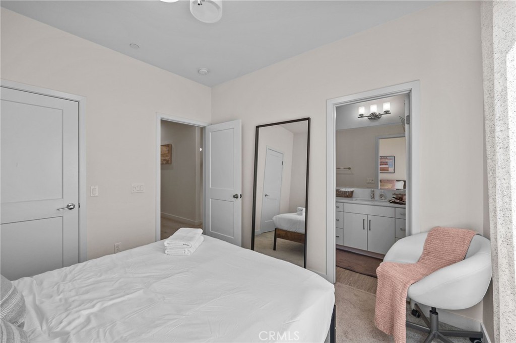 9040 Garvey Avenue, Unit 5 Rosemead, CA 91770 - Photo 30 of 33 a bedroom with a bed and a chair