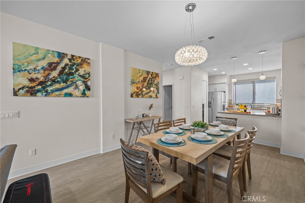 9040 Garvey Avenue, Unit 5 Rosemead, CA 91770 - Photo 3 of 33 a view of a dining room with furniture and chandelier