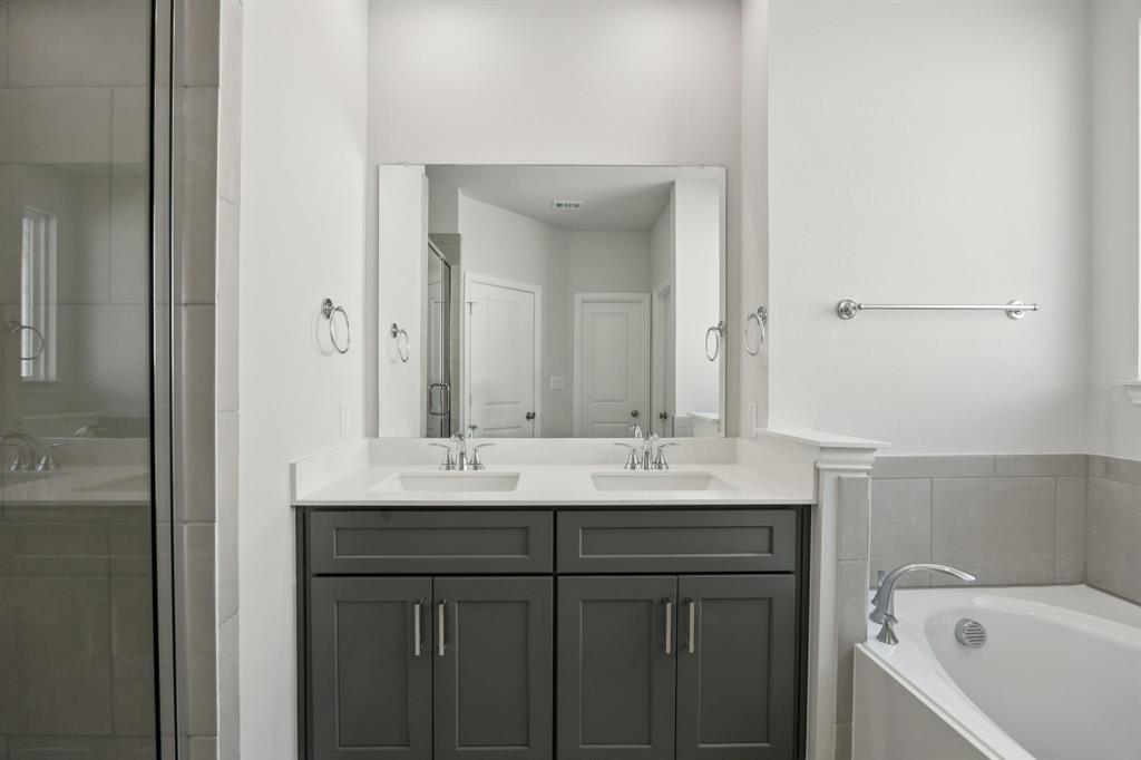 529 Magellan Road Seagoville, TX 75159 - Photo 11 of 37 a bathroom with a sink and a mirror