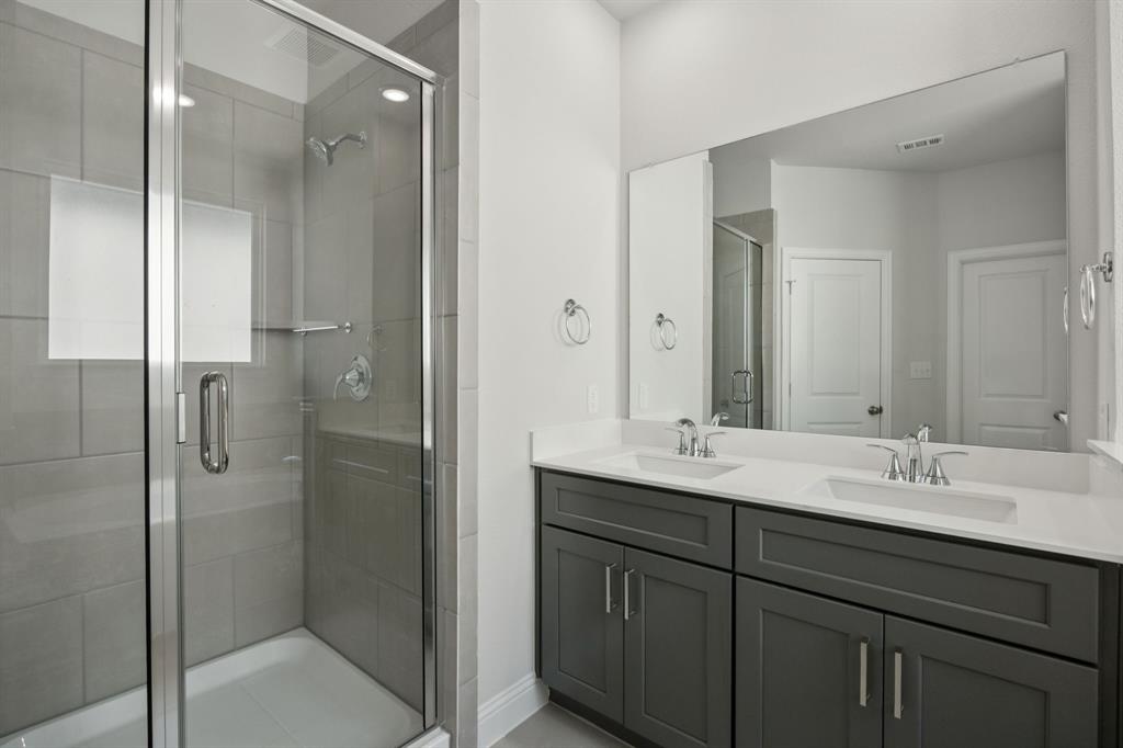 529 Magellan Road Seagoville, TX 75159 - Photo 12 of 37 a bathroom with a double vanity sink mirror and double