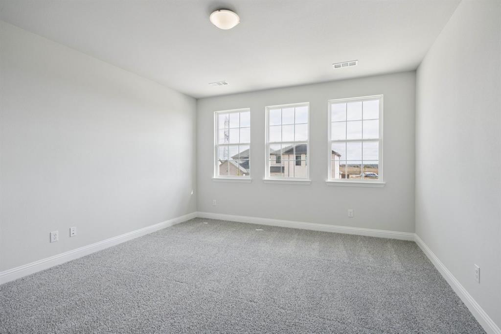 529 Magellan Road Seagoville, TX 75159 - Photo 13 of 37 an empty room with windows