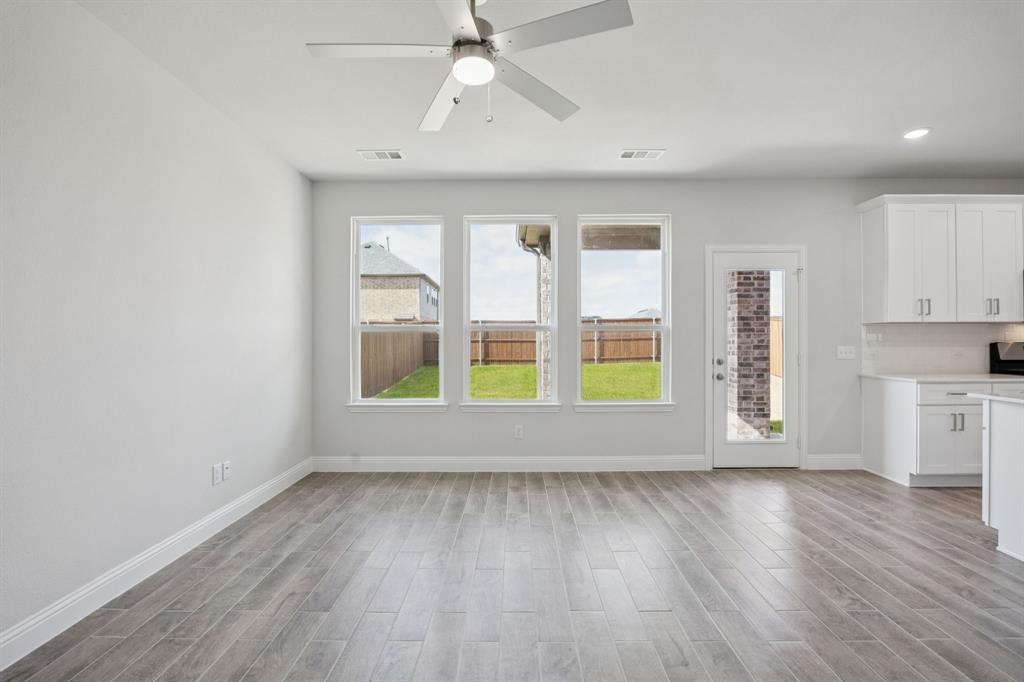 529 Magellan Road Seagoville, TX 75159 - Photo 7 of 37 a view of room with window and wooden floor