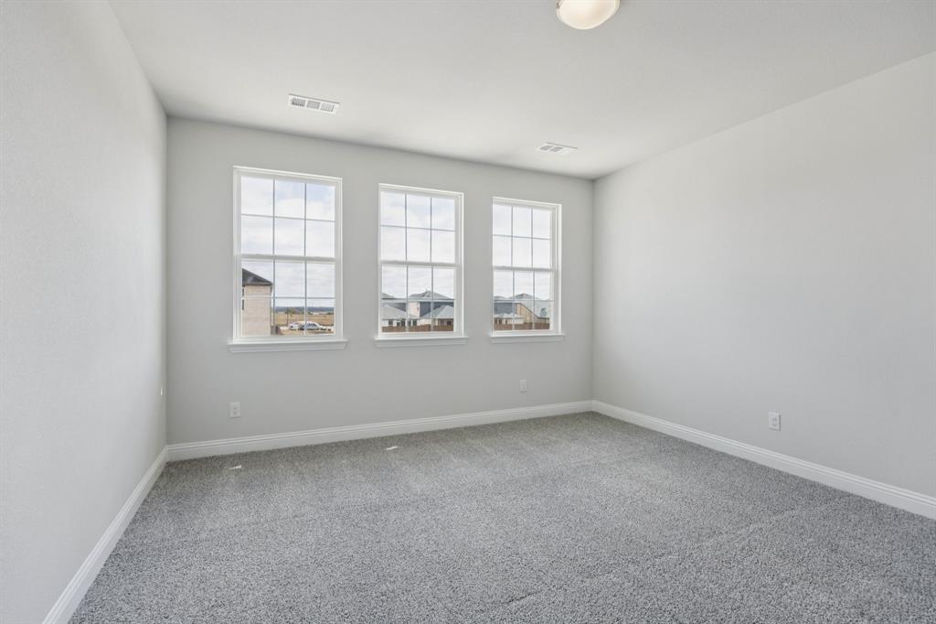 529 Magellan Road Seagoville, TX 75159 - Photo 9 of 37 an empty room with windows