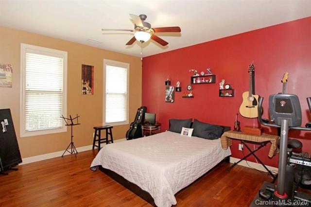 165 Regency Road Salisbury, NC 28147 - Photo 22 of 47 a bedroom with a bed and a chandelier