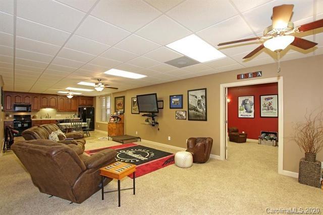165 Regency Road Salisbury, NC 28147 - Photo 29 of 47 a living room with furniture a chandelier and a pool table