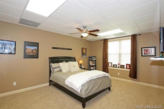 165 Regency Road Salisbury, NC 28147 - Photo 34 of 47 a bedroom with a large bed and a large window
