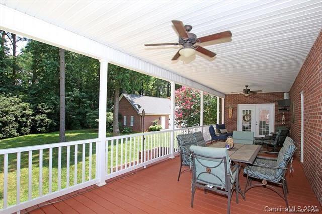 165 Regency Road Salisbury, NC 28147 - Photo 42 of 47 a view of a patio with a table chairs and a table
