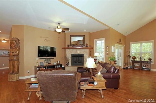 165 Regency Road Salisbury, NC 28147 - Photo 8 of 47 a living room with furniture a fireplace and a flat screen tv
