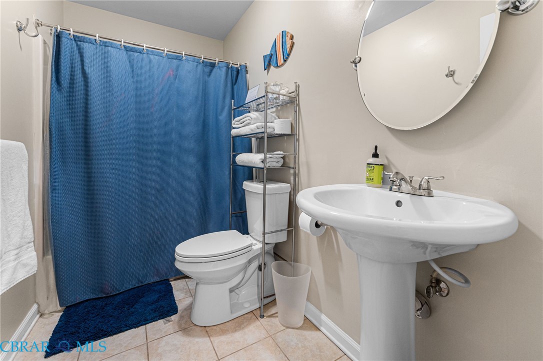 4775 Stormont Road Hartfield, VA 23071 - Photo 36 of 45 Bathroom with toilet and tile patterned floors