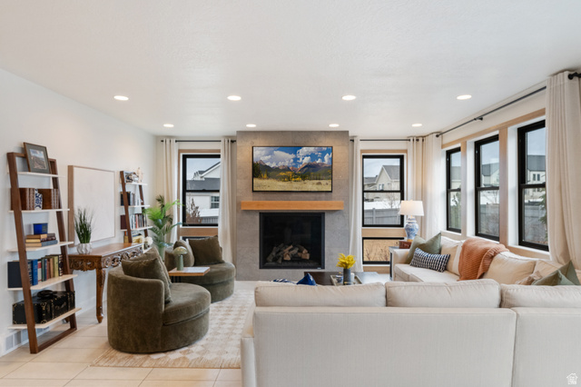 11617 South Wildrye Field Way Draper, UT 84020 - Photo 6 of 53 Living area with a fireplace, recessed lighting, and tile patterned flooring