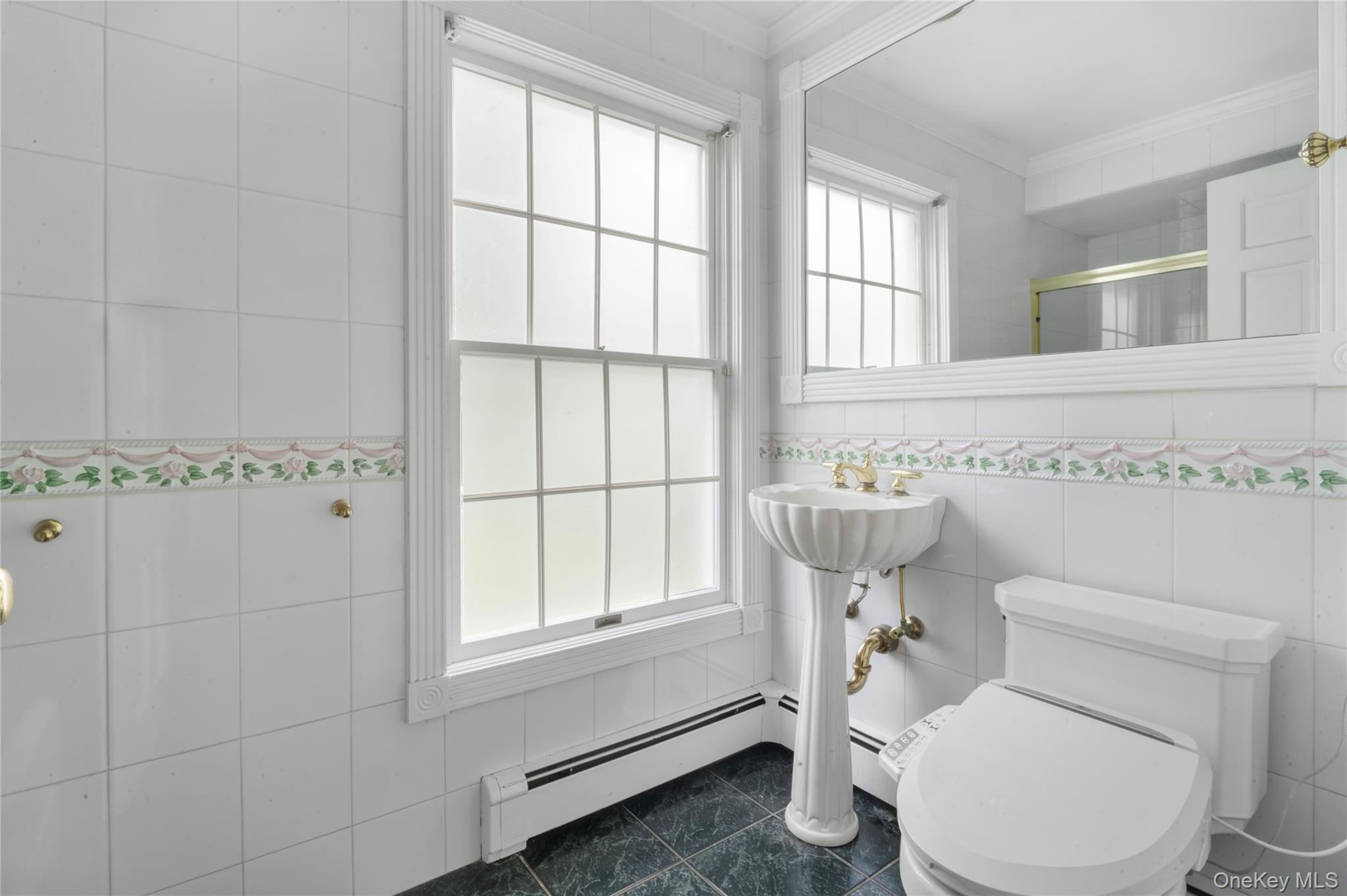 51 Bay Road Huntington Bay, NY 11743 - Photo 13 of 42 a white toilet sitting next to a window in a bathroom