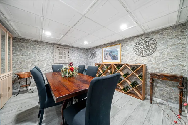 a bathroom with a granite countertop sink a mirror and shower