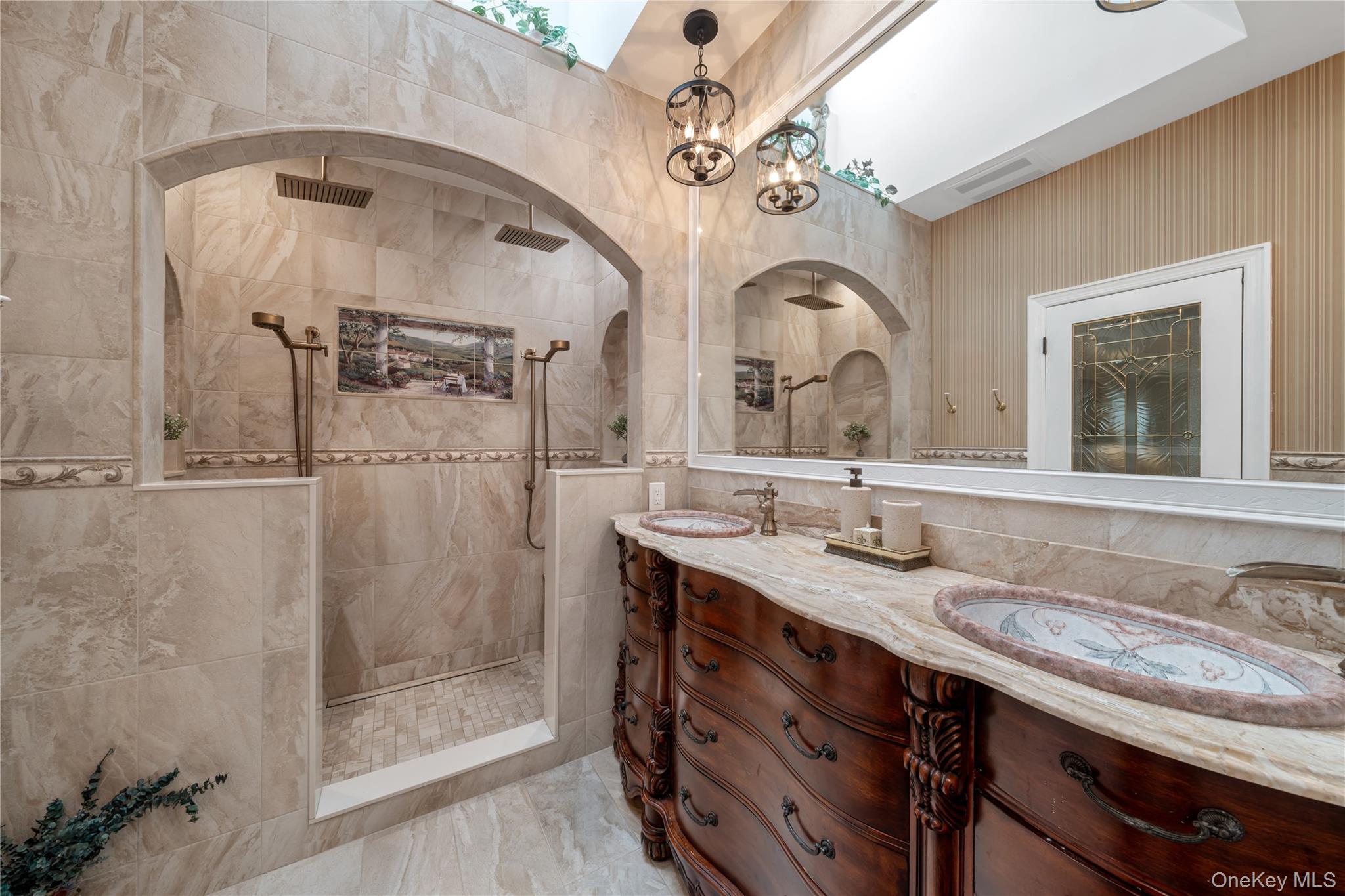 51 Bay Road Huntington Bay, NY 11743 - Photo 17 of 42 a bathroom with a granite countertop sink a mirror and shower