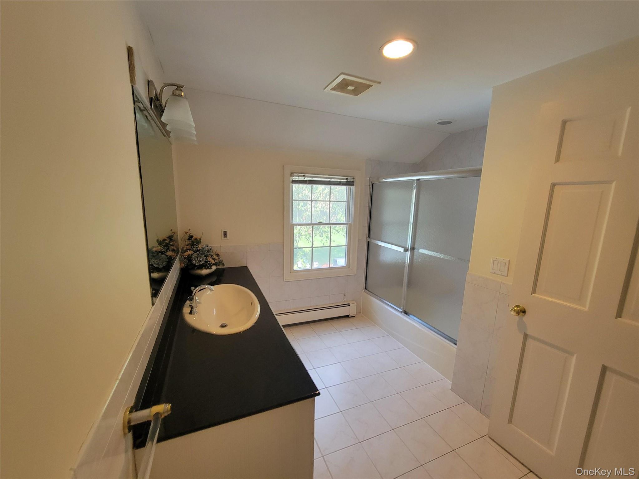 51 Bay Road Huntington Bay, NY 11743 - Photo 19 of 42 a bathroom with a granite countertop sink and a mirror